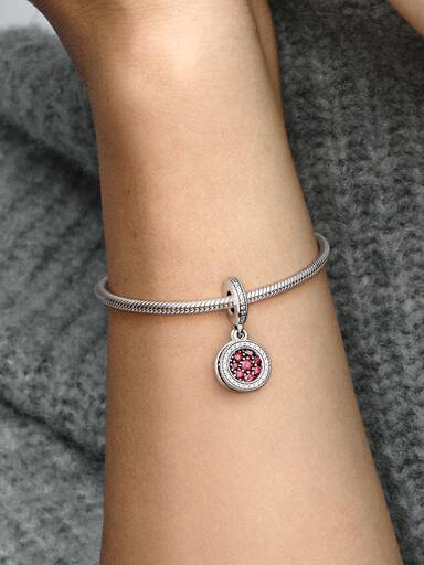 Circle and disc sterling silver dangle with red and clear cubic zirconia
