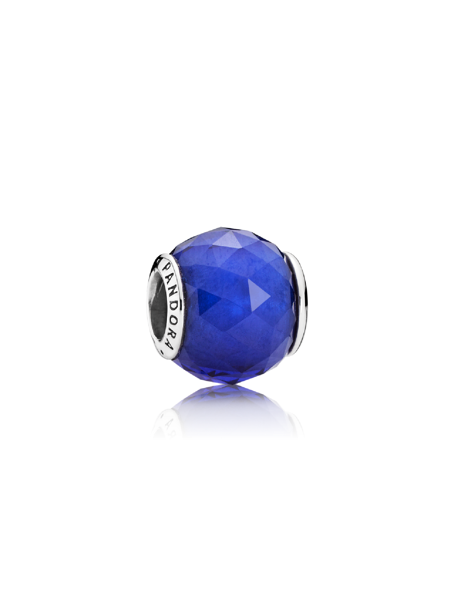 Abstract silver charm with faceted royal blue crystal
