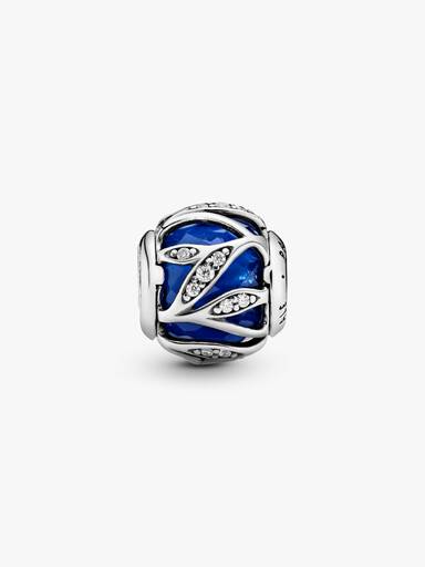 Abstract silver charm with faceted royal blue crystal and clear cubic zirconia