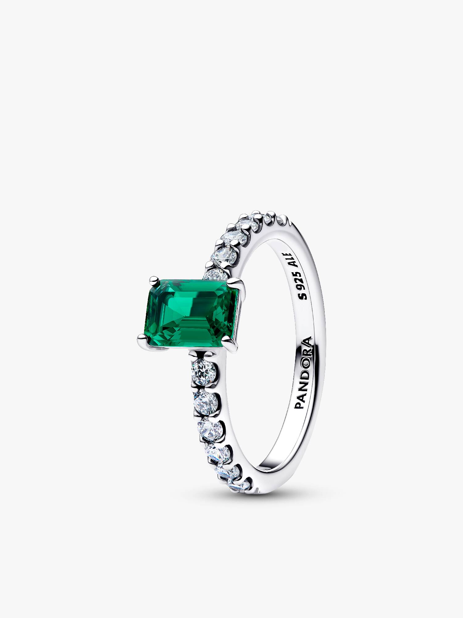 Anel retangular verde cintilante com halo.