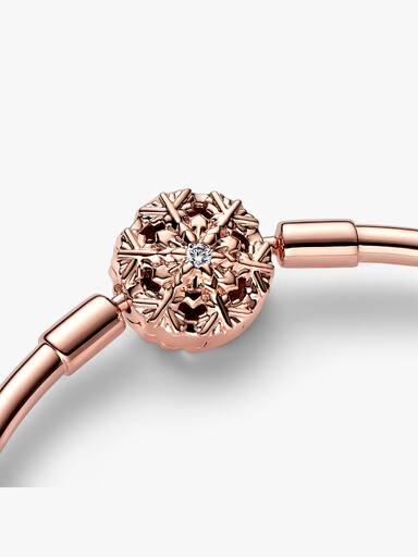 14k Rose gold-plated bangle with snowflake clasp and clear cubic zirconia