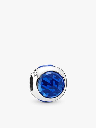 Silver charm with royal blue crystal