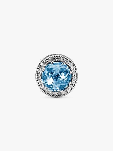 Abstract silver charm with sky blue crystal and clear cubic zirconia