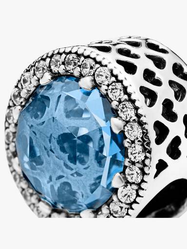 Abstract silver charm with sky blue crystal and clear cubic zirconia