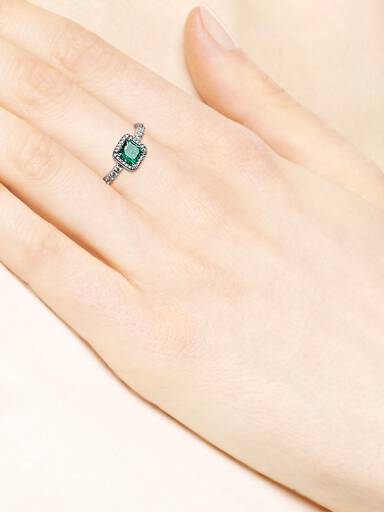 Silver ring with green and clear cubic zirconia