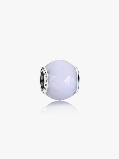 Abstract silver charm with faceted opalescent white crystal