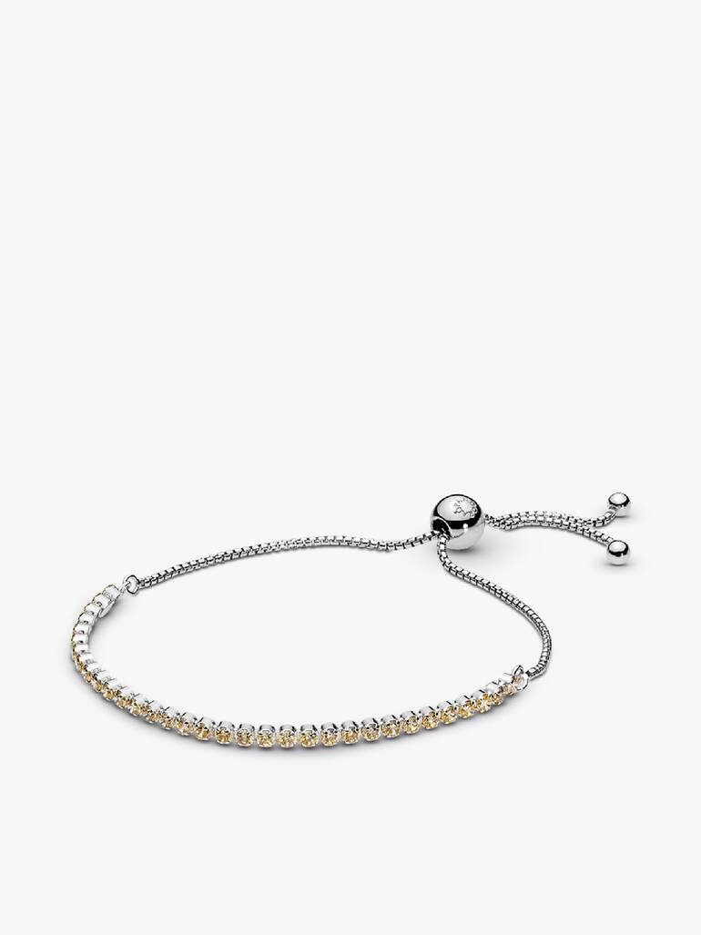 Rhodium plated silver bracelet with golden coloured cubic zirconia