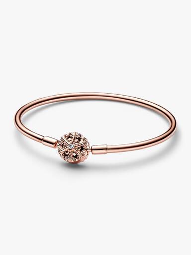14k Rose gold-plated bangle with snowflake clasp and clear cubic zirconia