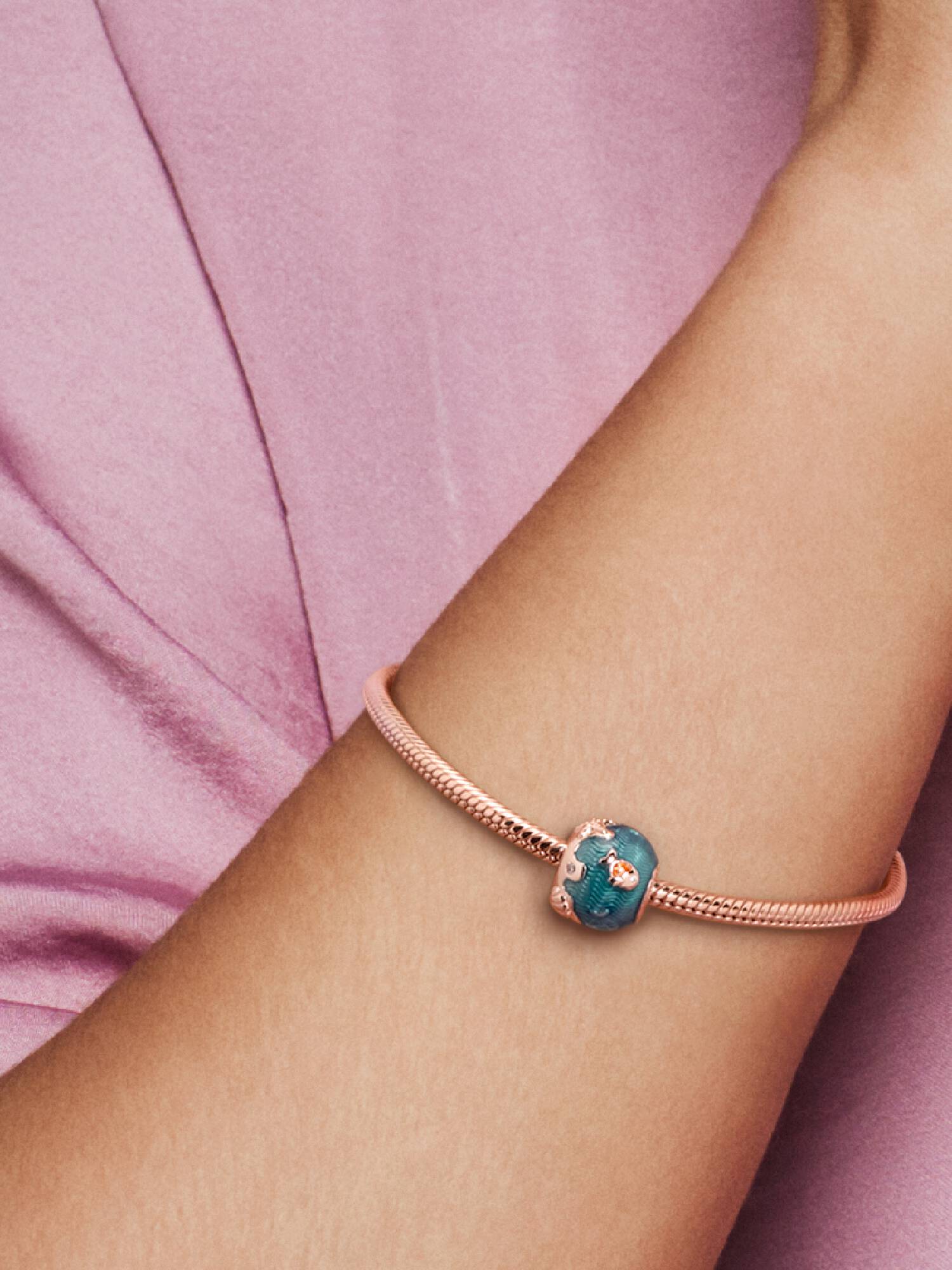 Fish and ocean 14k rose gold-plated charm with clear cubic zirconia and orange, blue enamel