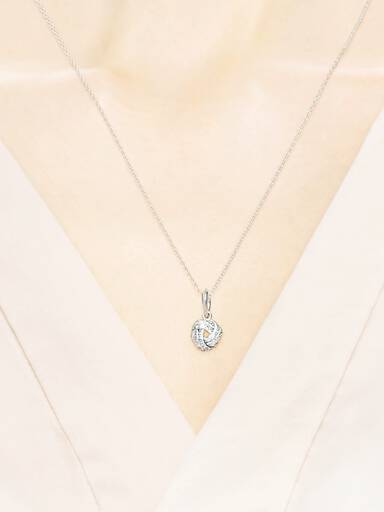 Love knot silver pendant with clear cubic zirconia