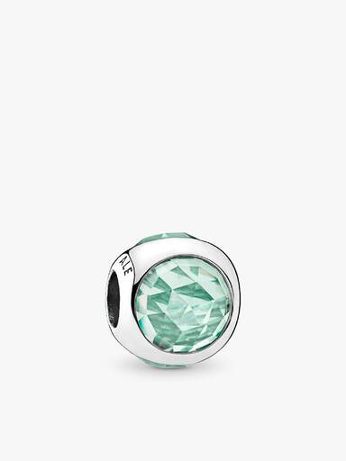 Silver charm with icy green crystal