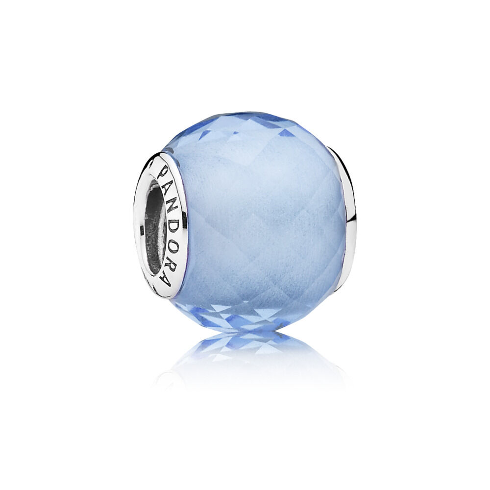 Abstract faceted silver charm with synthetic blue quartz