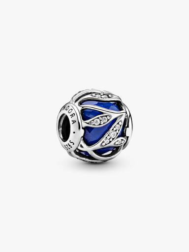 Abstract silver charm with faceted royal blue crystal and clear cubic zirconia